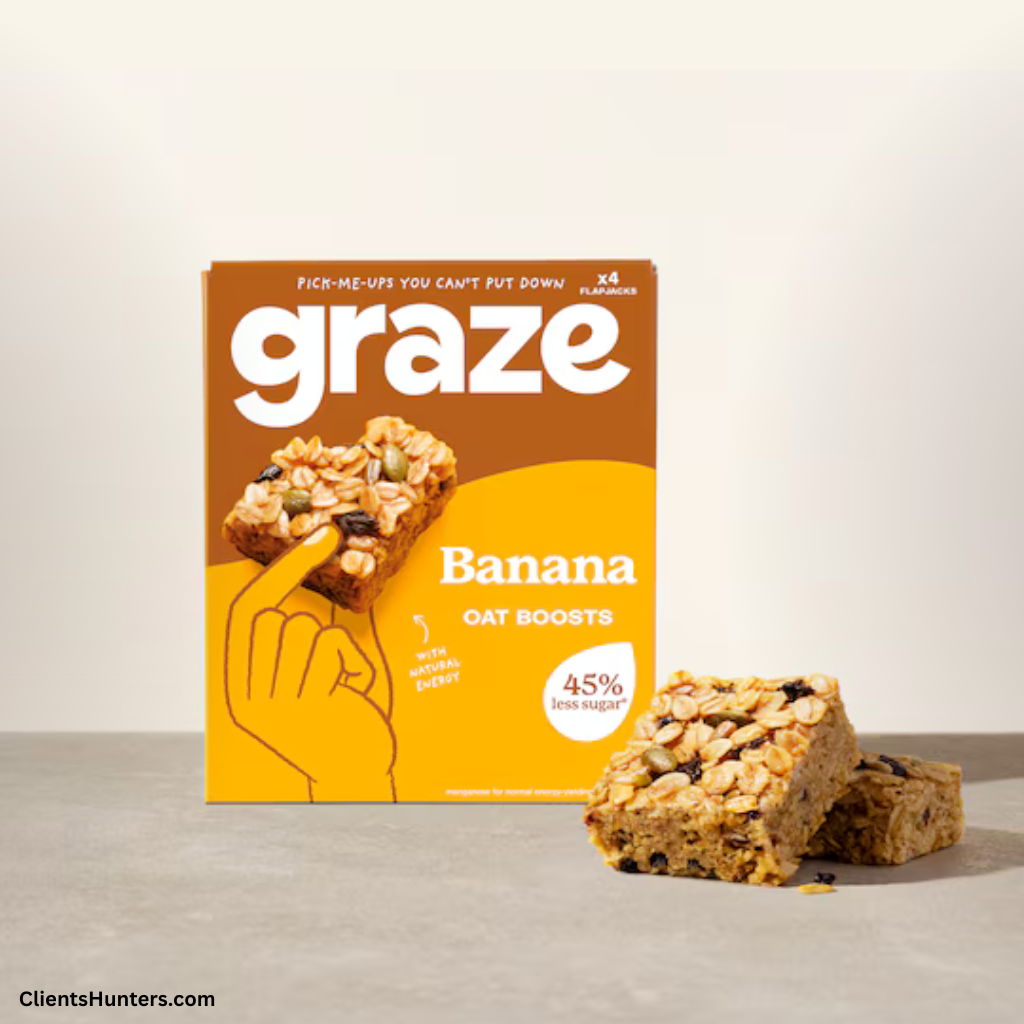 Graze Banana Oat Boosts box with two oat snack bars on a grey surface.