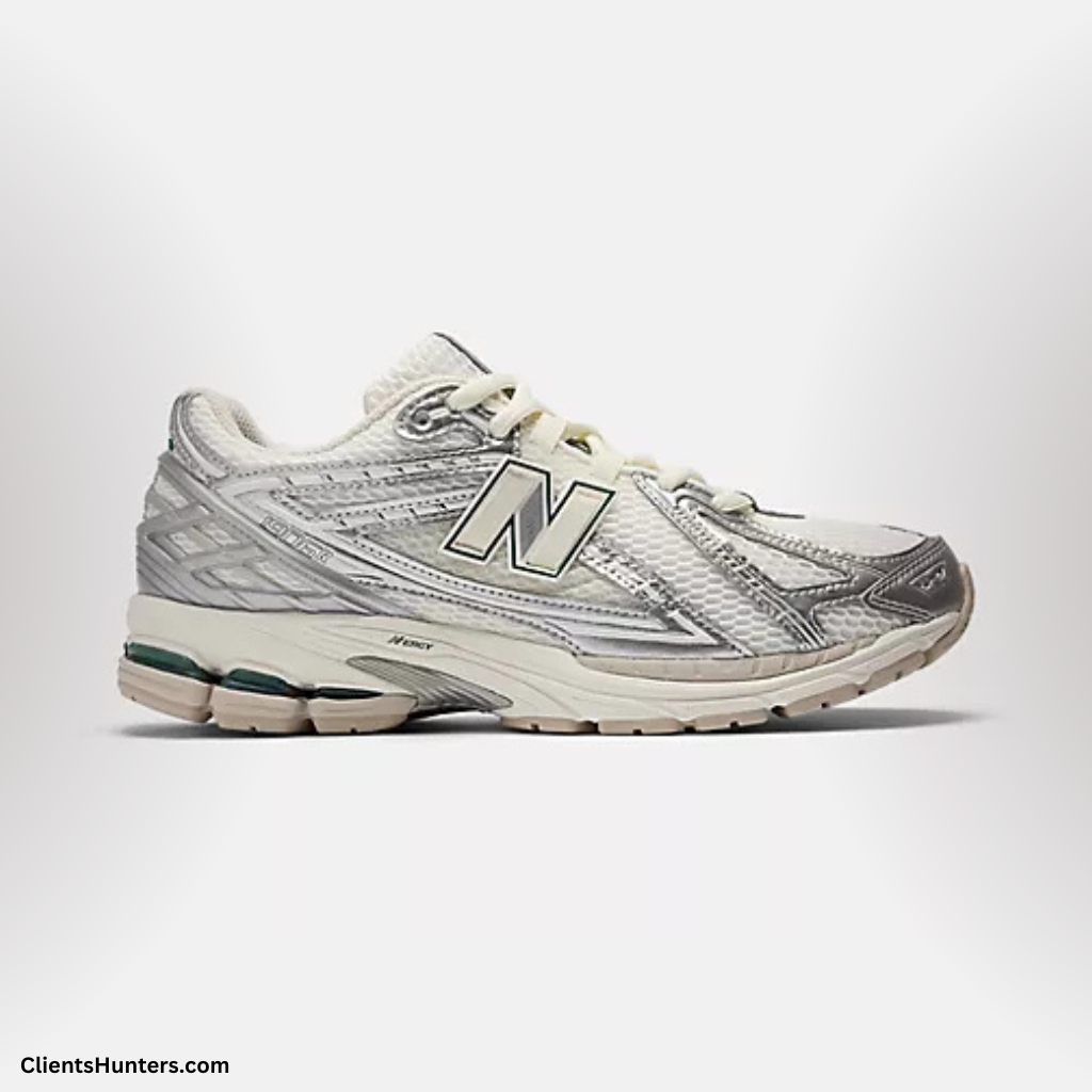 New Balance Made in USA sneaker in white and grey with ABZORB sole and retro-inspired design.
