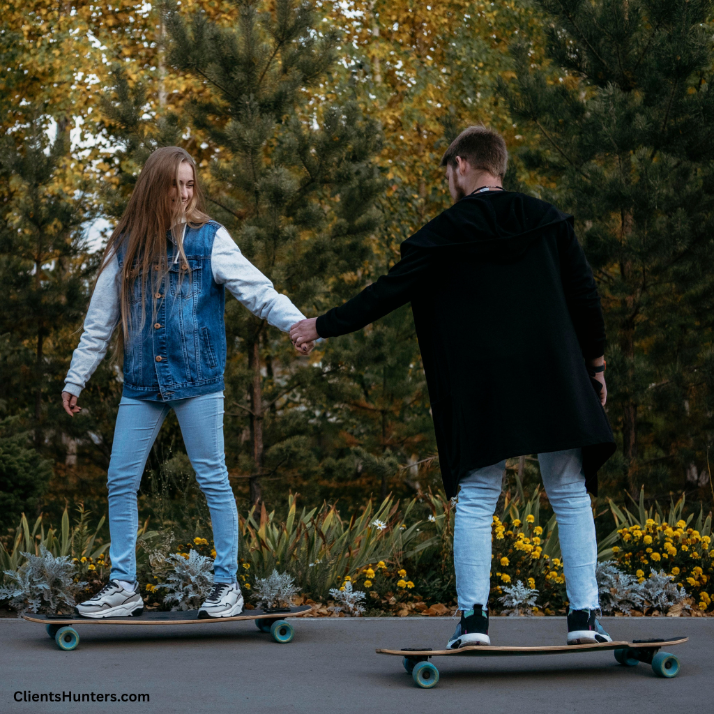 Two young adults riding electric skateboards through a park, holding hands and enjoying an eco-friendly commute.